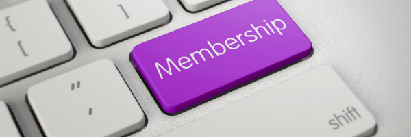 A close up view of a keyboard with a purple Membership button.